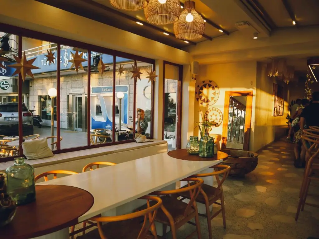 A dining area lit by the warm gaze of the afternoon sun.