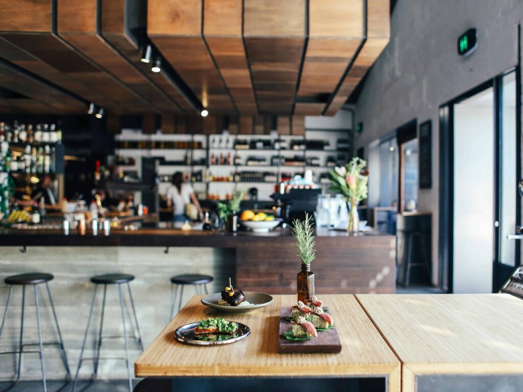 A stylish restaurant that uses natural elements as decor.