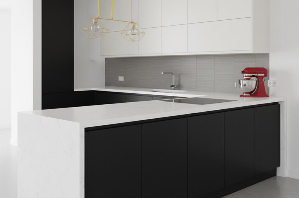 A modern L-shaped kitchen featuring matte black lower cabinets, white upper cabinets, a white marble countertop with a waterfall edge, and a red stand mixer as a focal point.