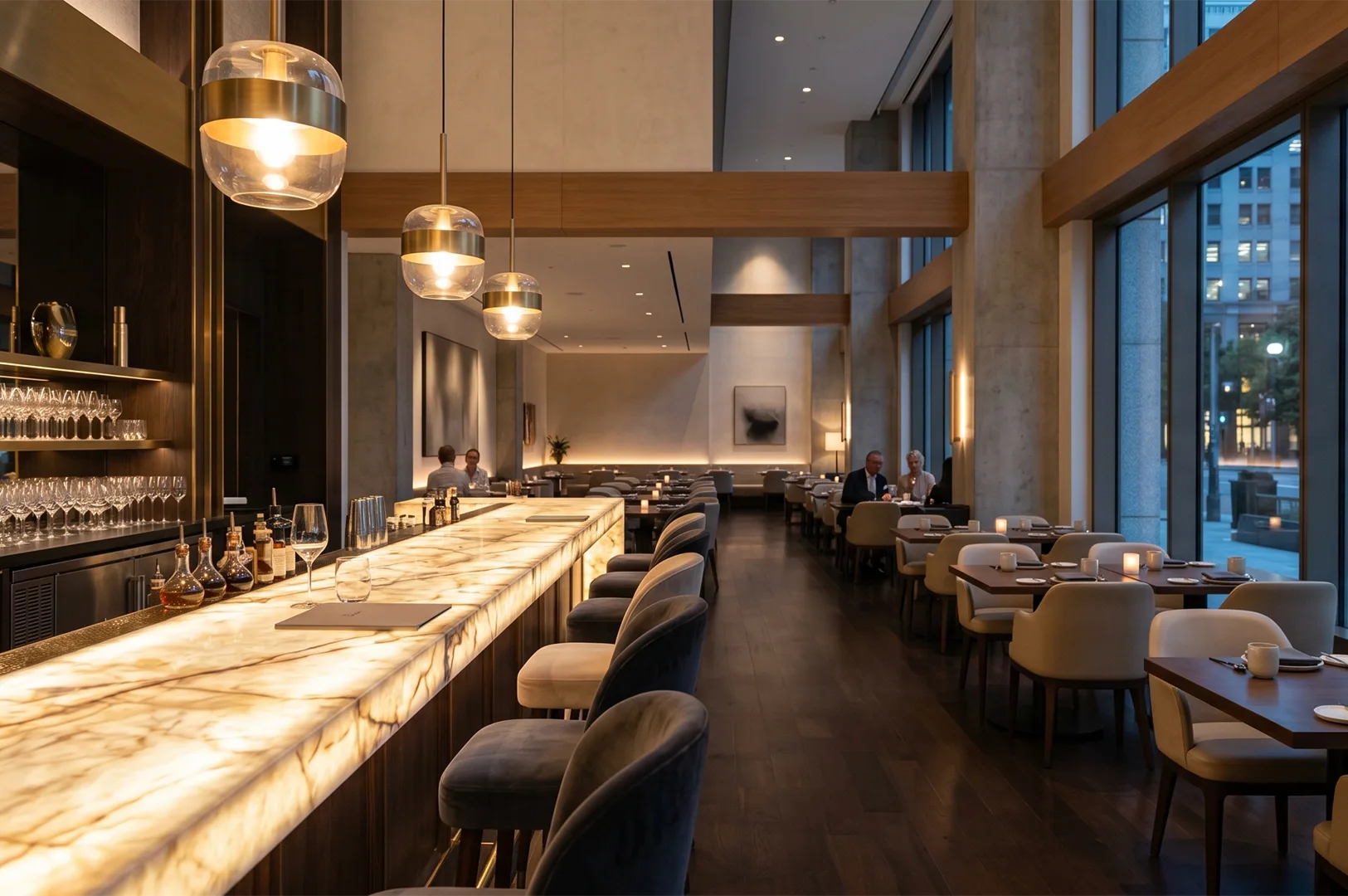 Sophisticated modern restaurant interior featuring a glowing backlit marble bar counter, brass pendant lighting, and warm wood accents.